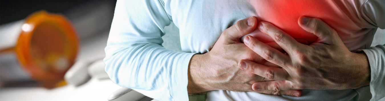 Man with pain holding chest